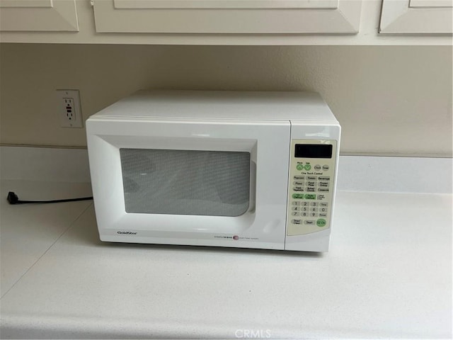 13361 N Fairfield Unit 180J, Seal Beach, CA 90740 - detailed view of white microwave