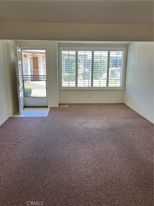 13361 N Fairfield Unit 180J, Seal Beach, CA 90740 - empty room with healthy amount of natural light and light carpet
