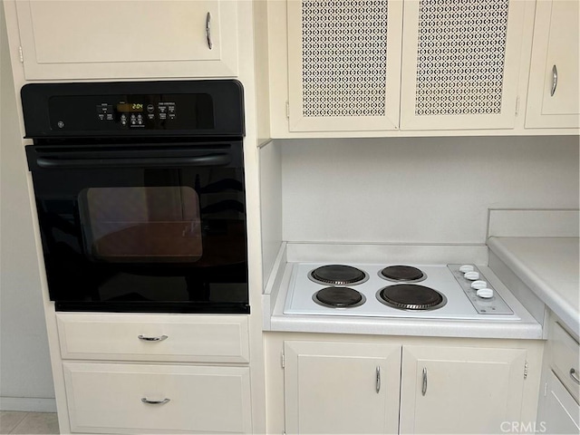 13361 N Fairfield Unit 180J, Seal Beach, CA 90740 - kitchen featuring oven, white electric cooktop, and white cabinets