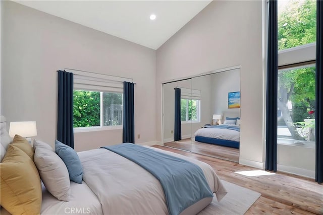 23415 Park Hacienda, Calabasas, CA 91302 - bedroom with high vaulted ceiling, wood finished floors, recessed lighting, and a closet