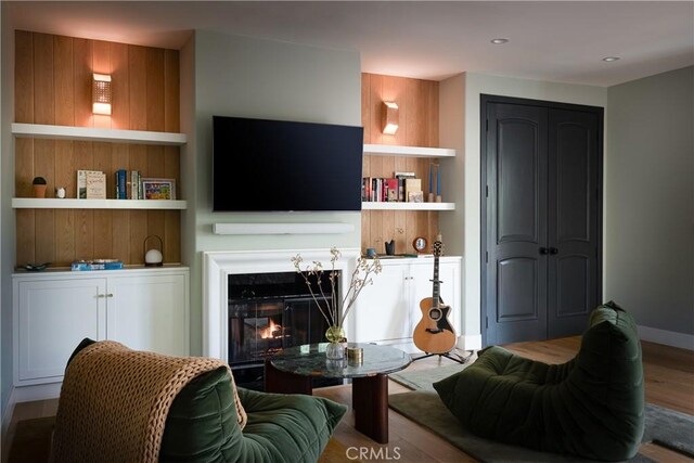 4620 Morse Ave, Sherman Oaks, CA 91423 - living area featuring wood finished floors and a warm lit fireplace