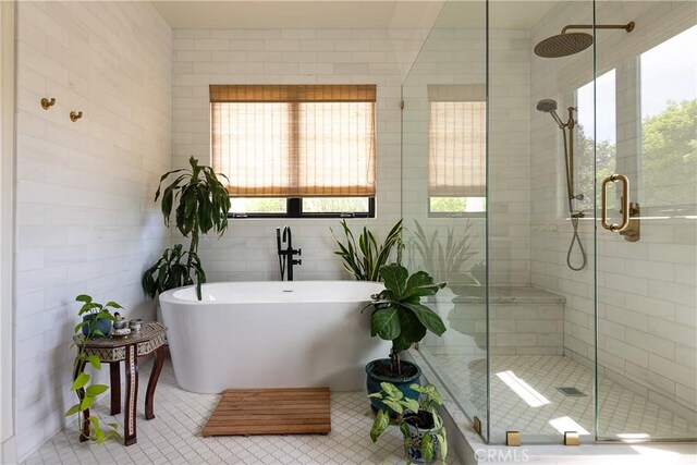 4620 Morse Ave, Sherman Oaks, CA 91423 - full bath featuring healthy amount of natural light, a stall shower, a freestanding bath, tile patterned flooring, and tile walls