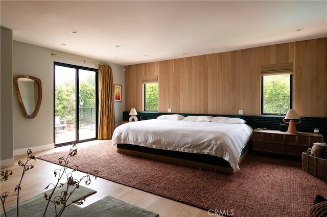 4620 Morse Ave, Sherman Oaks, CA 91423 - bedroom featuring access to exterior, wood finished floors, and wood walls