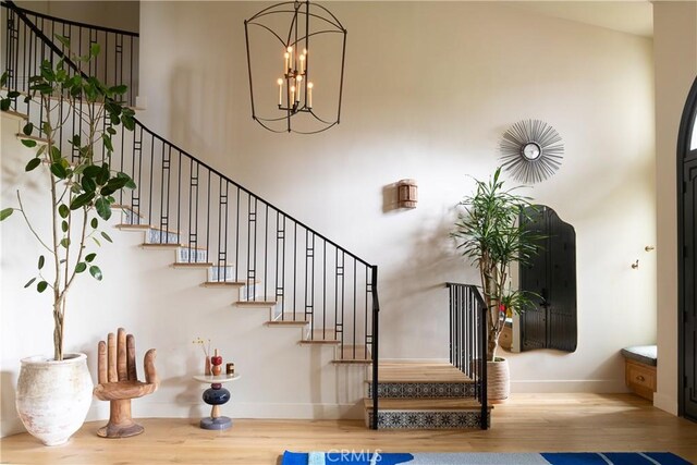4620 Morse Ave, Sherman Oaks, CA 91423 - stairway featuring wood finished floors and a chandelier