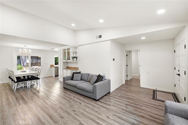 22391 Lombardi, Laguna Hills, CA 92653 - living area with light wood finished floors, recessed lighting, a chandelier, and high vaulted ceiling