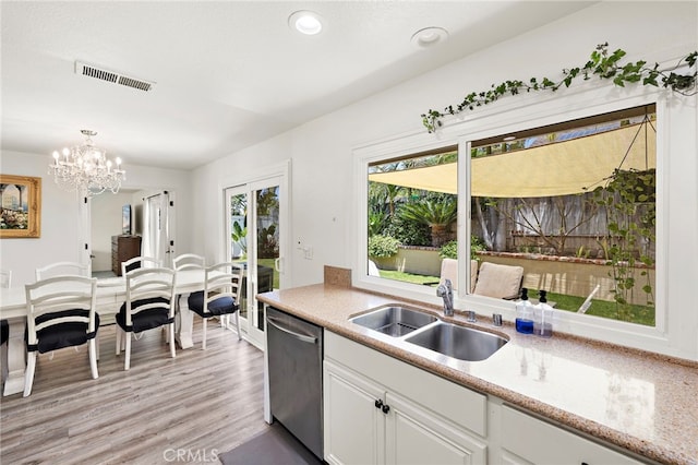 22391 Lombardi, Laguna Hills, CA 92653 - kitchen with dishwasher, a chandelier, light wood-style flooring, white cabinets, and pendant lighting