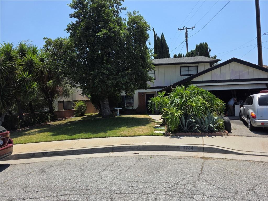 4734 Helmgate Dr, El Monte, CA 91732 - view of front facade with a garage and a front lawn