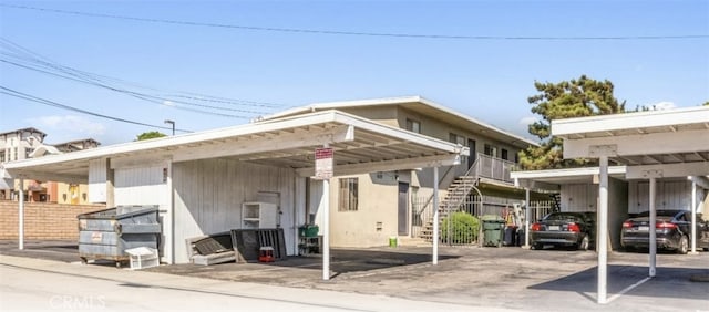 625-627 S Wabash Ave, Glendora, CA 91740 - rear view of house featuring stairs and covered parking