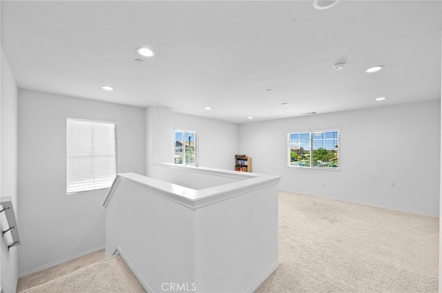 5609 Garibaldi Way, Fontana, CA 92336 - hallway featuring an upstairs landing, healthy amount of natural light, recessed lighting, and light carpet