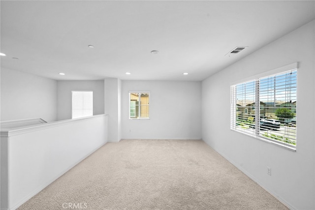 5609 Garibaldi Way, Fontana, CA 92336 - spare room with healthy amount of natural light, recessed lighting, and carpet