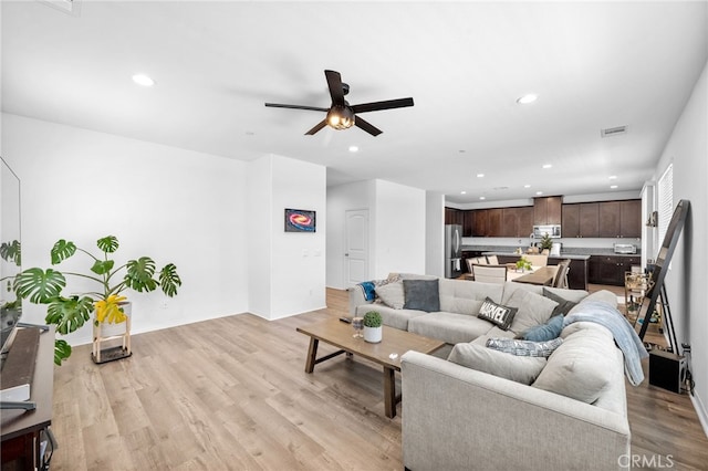 5609 Garibaldi Way, Fontana, CA 92336 - living area featuring recessed lighting, light wood-style flooring, and a ceiling fan