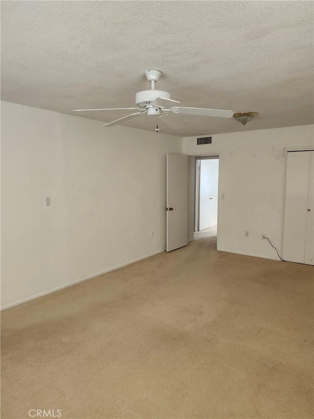 28635 Middlebury Way, Menifee, CA 92586 - spare room with a ceiling fan, light carpet, and a textured ceiling