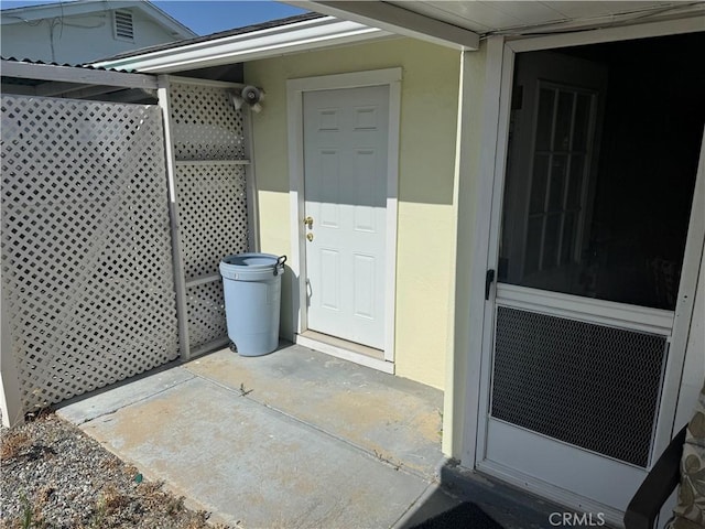 28635 Middlebury Way, Menifee, CA 92586 - property entrance with a security system and stucco siding