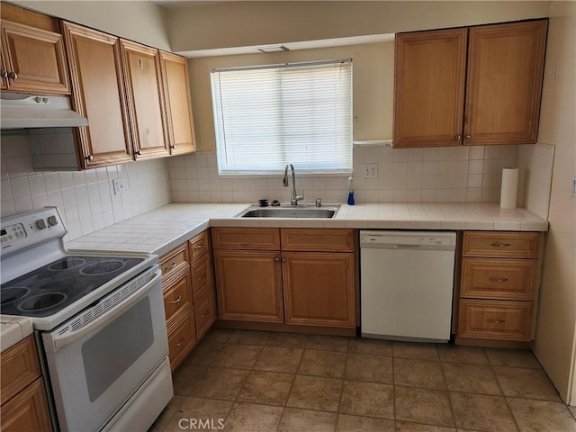 28635 Middlebury Way, Menifee, CA 92586 - kitchen with white appliances, under cabinet range hood, and tile countertops