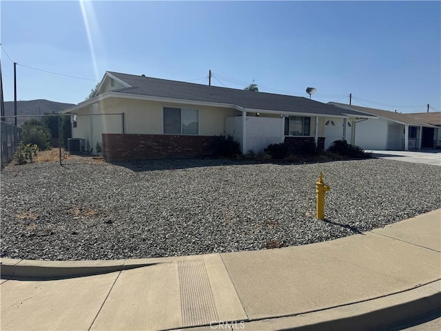 28635 Middlebury Way, Menifee, CA 92586 - ranch-style house featuring a garage, brick siding, and driveway