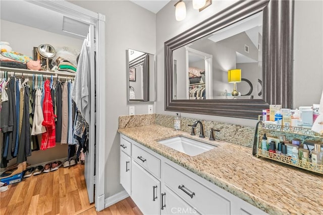 6210 Hartford Rd Unit 201, Yorba Linda, CA 92887 - bathroom featuring vanity, wood finished floors, and a spacious closet