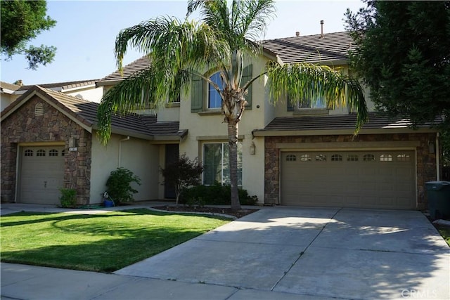 3569 Sepulveda Ave, Merced, CA 95348 - view of front of property with stone siding, a tiled roof, concrete driveway, stucco siding, and a front lawn