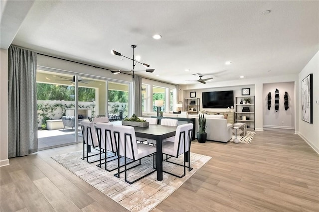 3091 Orchard Gln, Escondido, CA 92026 - dining room with a ceiling fan, recessed lighting, light wood-style floors, built in features, and a chandelier