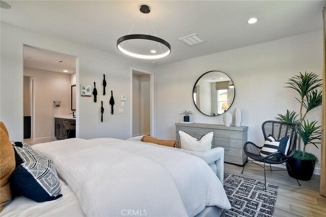 3091 Orchard Gln, Escondido, CA 92026 - bedroom featuring wood finished floors, recessed lighting, and connected bathroom