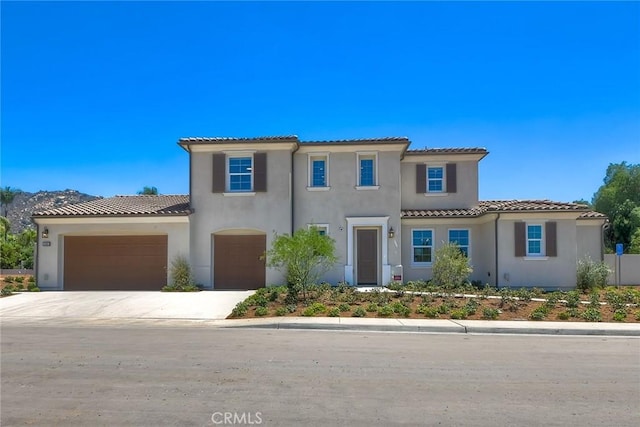 3091 Orchard Gln, Escondido, CA 92026 - mediterranean / spanish house featuring stucco siding, a tile roof, driveway, and an attached garage