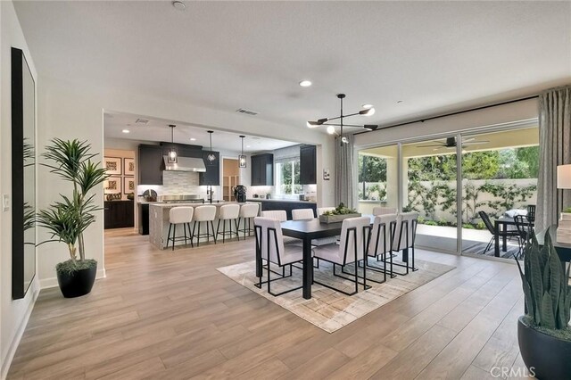 3091 Orchard Gln, Escondido, CA 92026 - dining area with light wood-type flooring, recessed lighting, and a chandelier