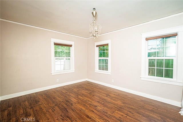 220 Palm Pl, Pomona, CA 91767 - empty room featuring a chandelier, dark wood-style flooring, and crown molding