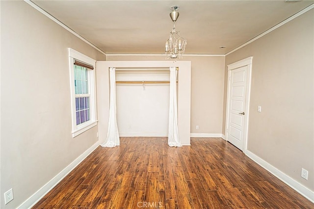 220 Palm Pl, Pomona, CA 91767 - unfurnished bedroom with ornamental molding, a closet, dark wood finished floors, and a chandelier