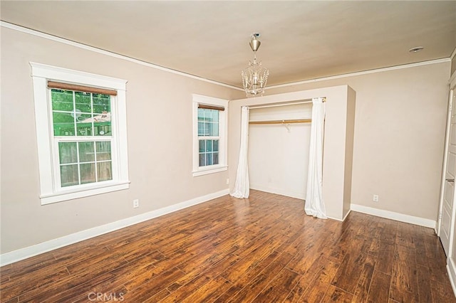 220 Palm Pl, Pomona, CA 91767 - unfurnished bedroom with a chandelier, ornamental molding, wood finished floors, and a closet