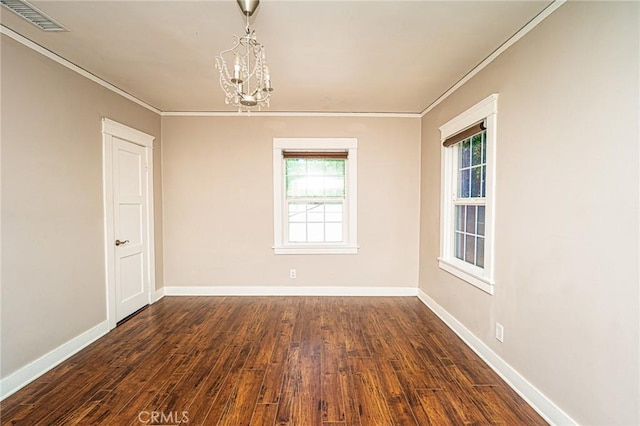 220 Palm Pl, Pomona, CA 91767 - spare room featuring ornamental molding, a chandelier, and dark wood finished floors