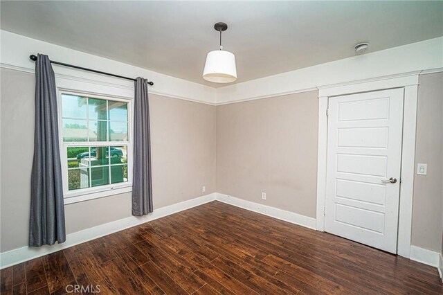 220 Palm Pl, Pomona, CA 91767 - empty room with dark wood finished floors and baseboards