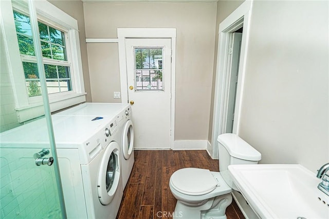 220 Palm Pl, Pomona, CA 91767 - washroom with washer and clothes dryer, dark wood-style flooring, and plenty of natural light