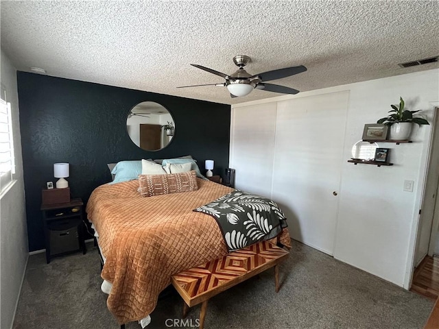 208 Spruce St, Arroyo Grande, CA 93420 - carpeted bedroom with a textured ceiling, a closet, and a ceiling fan