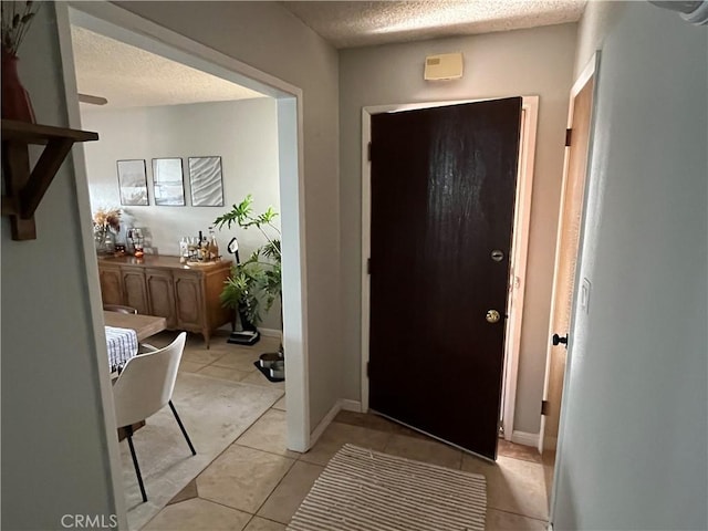 208 Spruce St, Arroyo Grande, CA 93420 - entrance foyer with light tile patterned floors and a textured ceiling