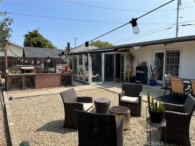 208 Spruce St, Arroyo Grande, CA 93420 - view of patio / terrace featuring a sunroom and a fire pit