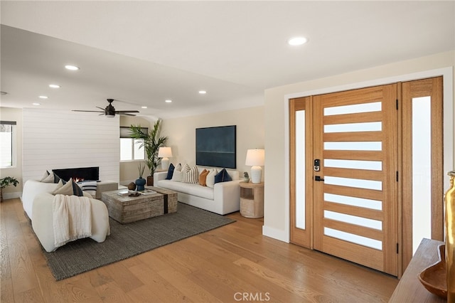 1700 Irvine Ave, Newport Beach, CA 92660 - living room with light wood-style flooring, recessed lighting, a fireplace, and ceiling fan