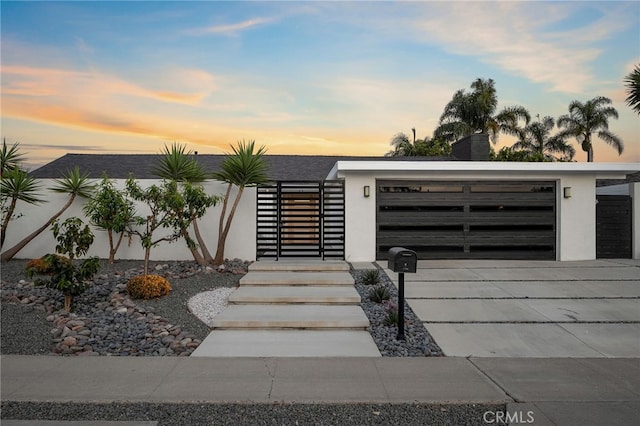 1700 Irvine Ave, Newport Beach, CA 92660 - modern home with stucco siding and concrete driveway
