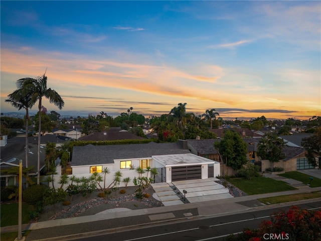 1700 Irvine Ave, Newport Beach, CA 92660 - contemporary house with concrete driveway, a residential view, and a garage