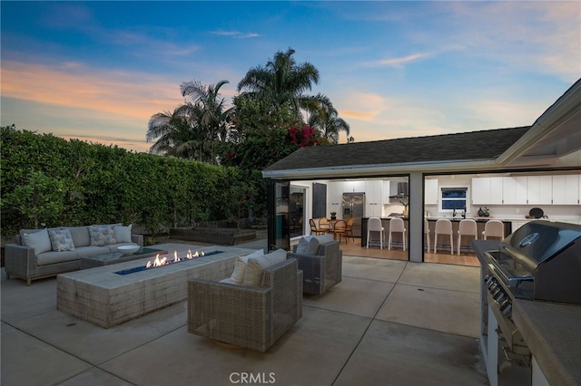 1700 Irvine Ave, Newport Beach, CA 92660 - view of patio with an outdoor living space with a fire pit
