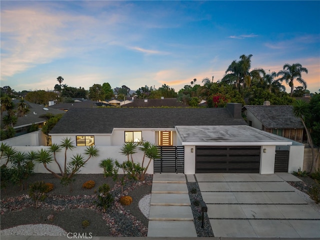 1700 Irvine Ave, Newport Beach, CA 92660 - modern home with a garage, driveway, and stucco siding