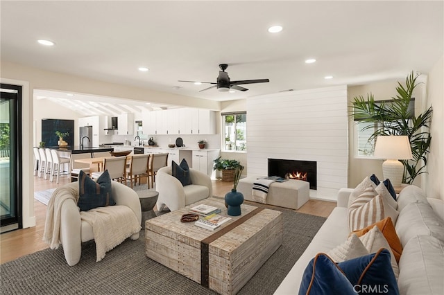 1700 Irvine Ave, Newport Beach, CA 92660 - living area featuring recessed lighting, light wood-style flooring, a ceiling fan, and a large fireplace