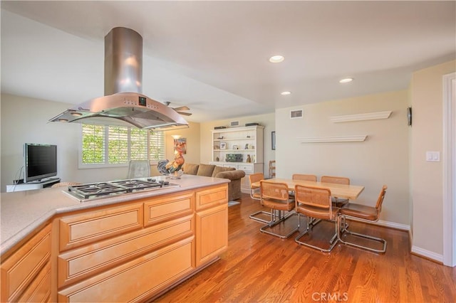 2526 Fontezuela Dr, Hacienda Heights, CA 91745 - kitchen with island range hood, open floor plan, stainless steel gas cooktop, light wood-style floors, and recessed lighting