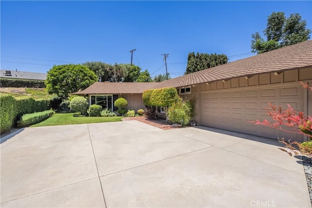 2526 Fontezuela Dr, Hacienda Heights, CA 91745 - single story home with board and batten siding, a garage, and driveway