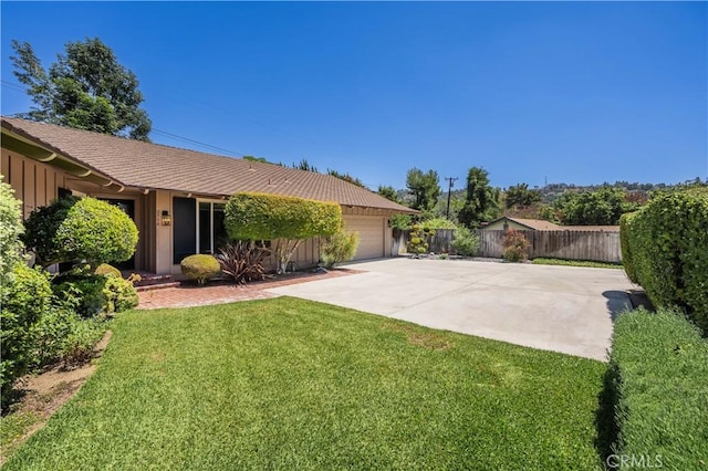 2526 Fontezuela Dr, Hacienda Heights, CA 91745 - view of front of property with a garage, driveway, and board and batten siding