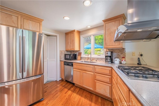 2526 Fontezuela Dr, Hacienda Heights, CA 91745 - kitchen with stainless steel appliances, island exhaust hood, light brown cabinetry, light countertops, and light wood-style flooring