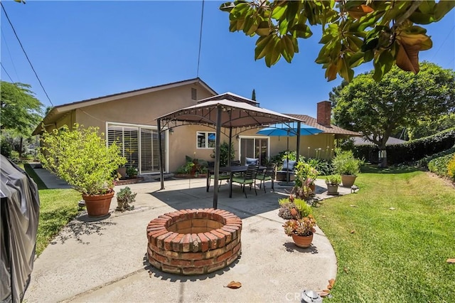 2526 Fontezuela Dr, Hacienda Heights, CA 91745 - rear view of house with a lawn, stucco siding, a patio area, an outdoor fire pit, and a chimney