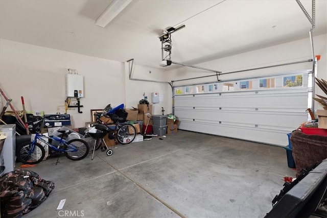 955 W Jasmine Way, Rialto, CA 92376 - garage with tankless water heater and a garage door opener