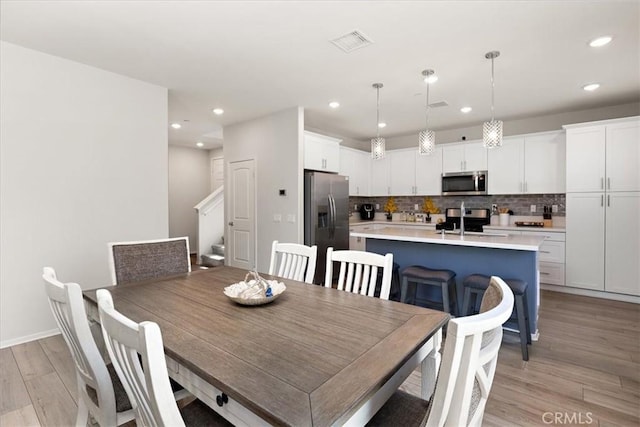 955 W Jasmine Way, Rialto, CA 92376 - dining area featuring light wood-style flooring and recessed lighting