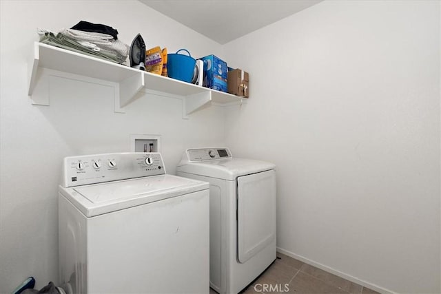 955 W Jasmine Way, Rialto, CA 92376 - laundry area with washing machine and clothes dryer and light tile patterned flooring