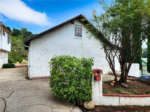 11860 W Trail Trail, Sylmar, CA 91342 - view of side of home with stucco siding