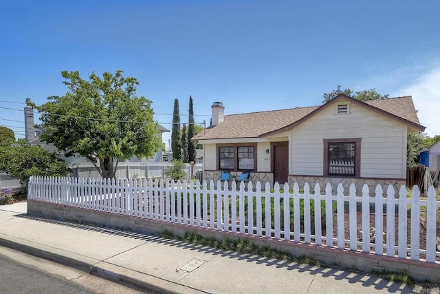 4693 71st St, La Mesa, CA 91942 - view of front of home with a shingled roof, a chimney, and a fenced front yard